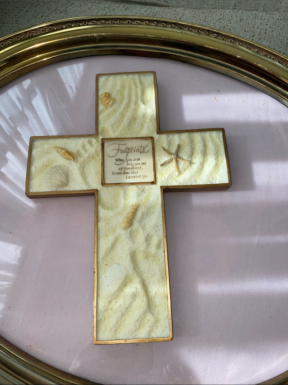 Footprints in the sand cross